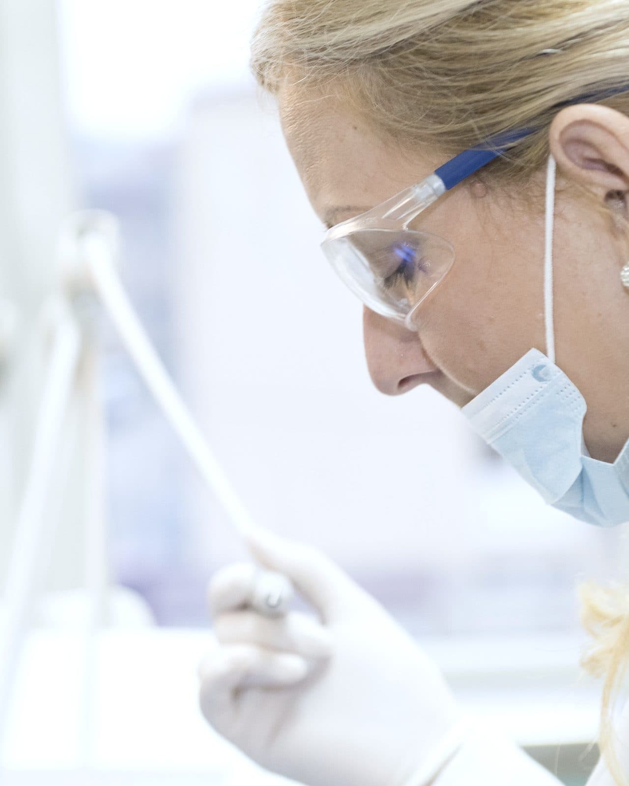 A dentist examining a patient's teeth